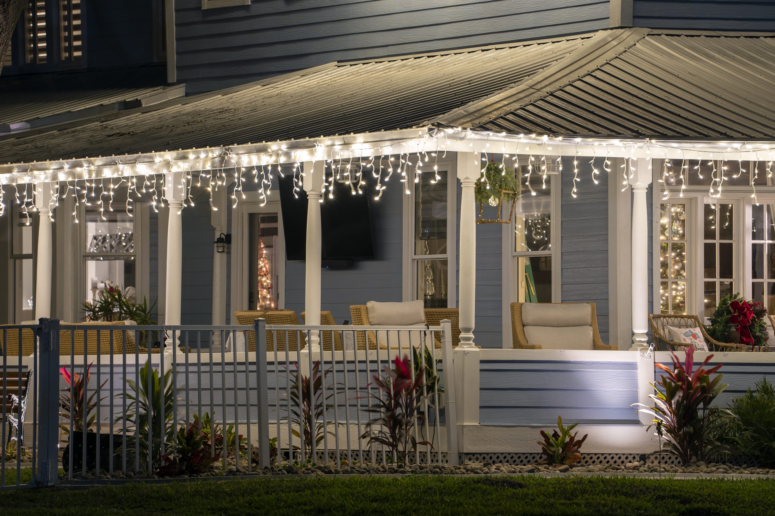 wrap-around deck around blue home representing decks