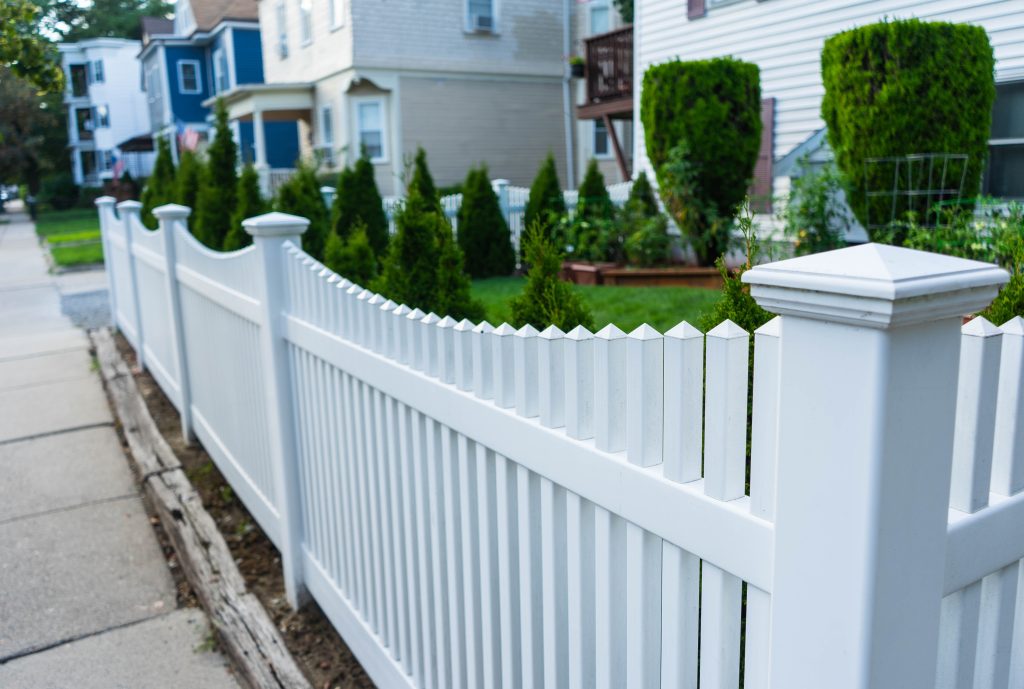 white-picket-fence-residential-neighborhood-houses-2024-10-17-14-40-36-utc white vinyl fencing style outside of home
