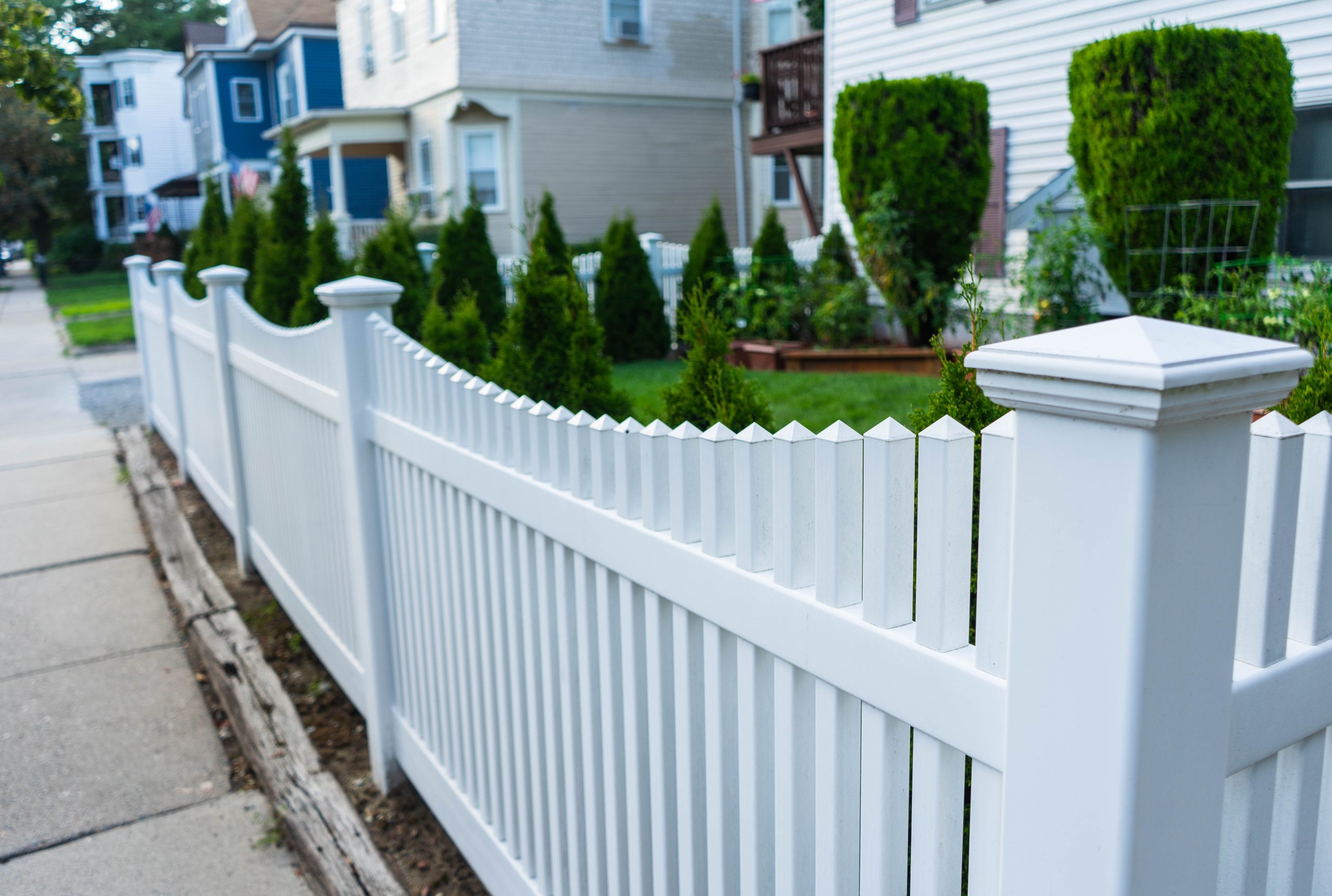 white vinyl fencing style outside of home 